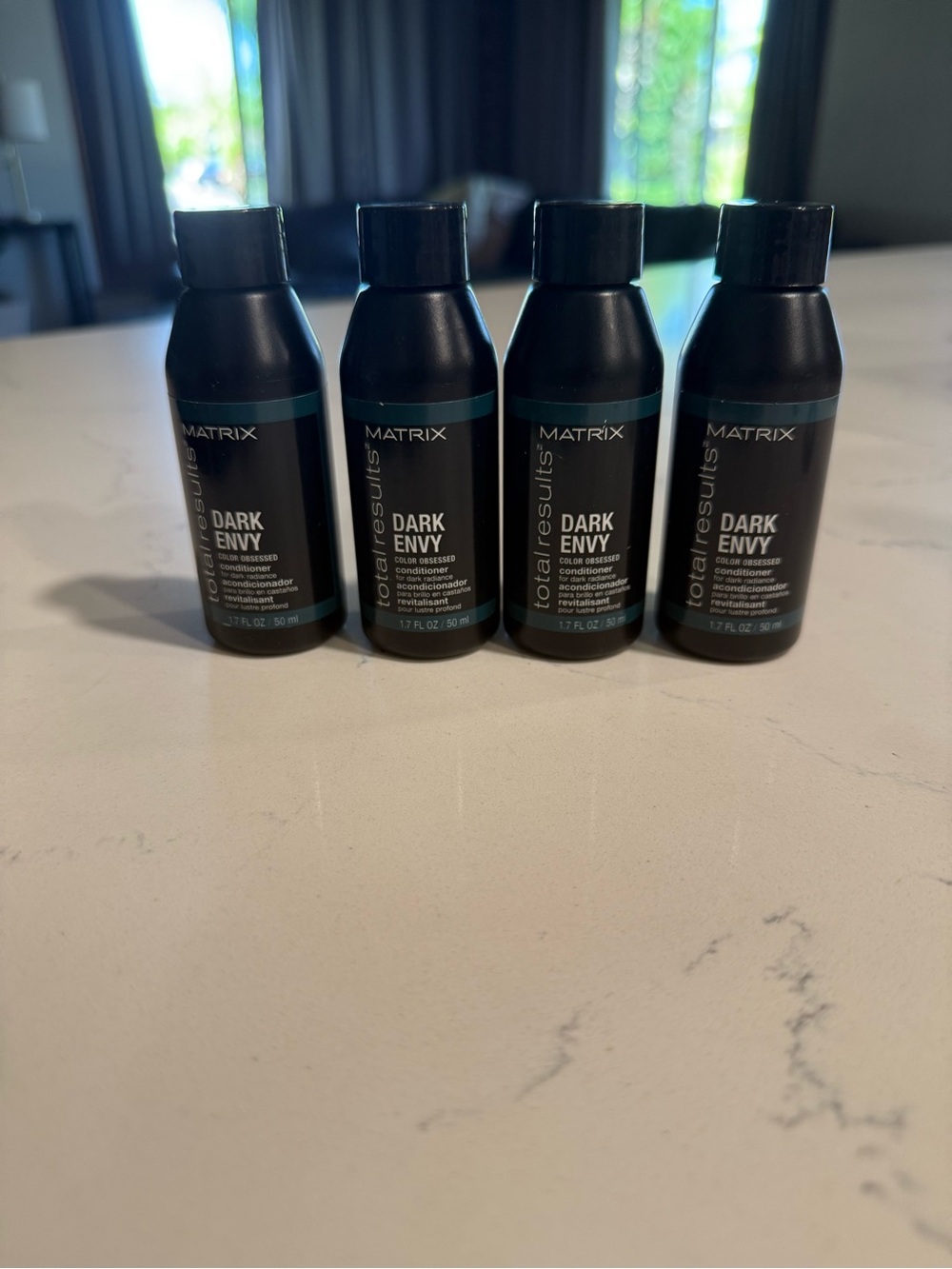 Matix Dark Envy Mini Shampoo Bottles in Black with Teal Accent